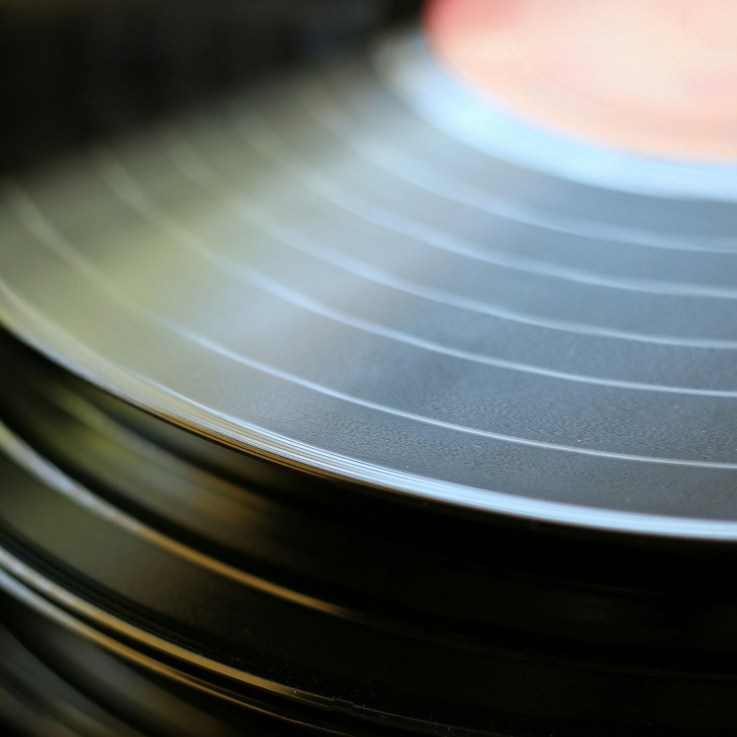 Macro close-up of the concentric grooves on a black record
